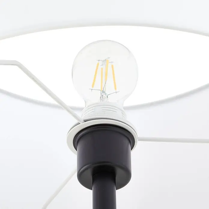 Lindby Stehlampe Wohnzimmer in schwarz, creme, Stehleuchte -  - Klare LED-Birne in schwarzer Lampenfassung mit weißem Schirmgestell.