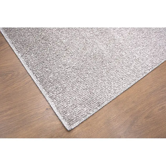 Alfombra de pelo corto Bicolor - Gris, 230 x 160 cm, 100% poliéster - Primer plano de una alfombra gris texturizada sobre un suelo de madera marrón.