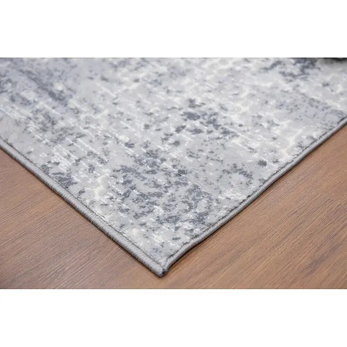 Alfombra de pelo corto Piel - Gris, 230 x 160 cm, 100% poliéster - Alfombra gris y blanca con estampado abstracto sobre suelo de madera.