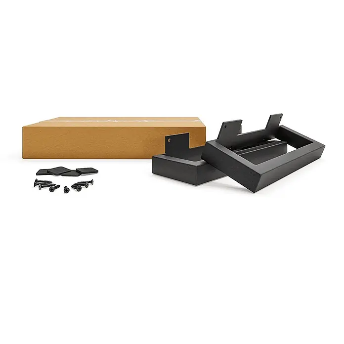 HEVVA Möbelfuß-Set GRAZ - L x B x H: 20 x 3 x 10 cm, Metall, 2 Stk. - Montagesatz mit zwei schwarzen Metallhalterungen, schwarzen Schrauben, schwarzen Polstern und einem braunen Karton.