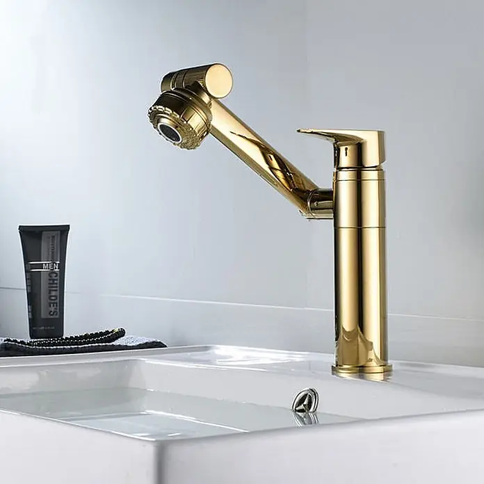 Hudor Waschtischarmatur 6959 - Hochglänzend - Glänzender goldener Wasserhahn mit ausziehbarer Brause in einem weißen Waschbecken.