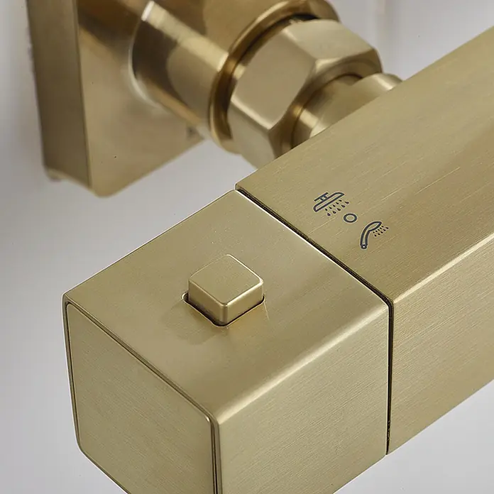 Hudor Duschsystem Scamandre SC428 Thermostat -  - Gebürstete goldene quadratische Duscharmatur mit Druckknopf, zeigt Symbole für Kopf- und Handbrause.