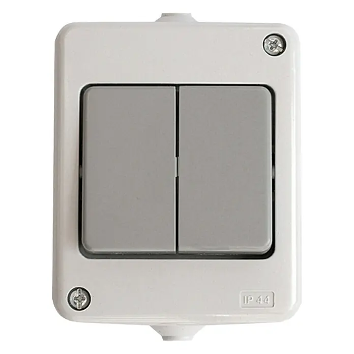 Voltomat FLUID Conmutador doble para estancias con humedad - Gris, Montaje en superficie, IP44 - Interruptor de luz doble gris en una carcasa blanca y rectangular. Ideal para cuartos húmedos, ya que es resistente a salpicaduras.