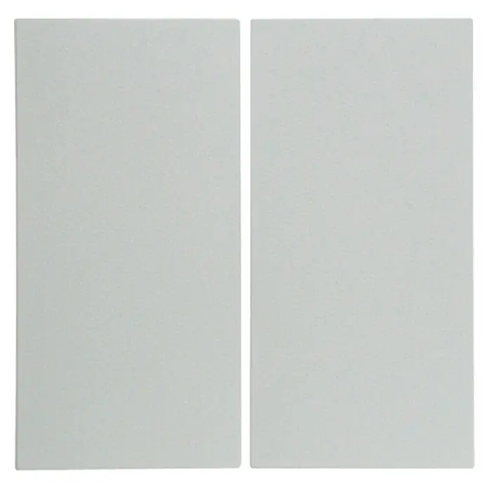 Berker S.1 Serienschalterwippe 16238989 - Polarweiß glänzend, Kunststoff, IP20 - Zwei weiße, rechteckige Schaumstoffplatten liegen nebeneinander. Ideal für Bastelarbeiten oder zur Schalldämmung.