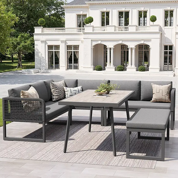 SONNENH Loungemöbel-Set 5-teilig für 6–8 Personen Grau -  - Modernes graues Outdoor-Ecksofa und Essset mit Tisch in Holzoptik auf einer Terrasse.