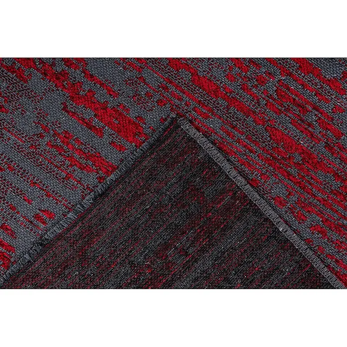 Kayoom Flachgewebeteppich Kalea 125 - Rot, 170 x 120 cm, 100 % Polyester - Moderner Teppich mit leuchtend rotem Abstraktmuster auf grauem Grund, gefaltet zur Ansicht der dunklen Rückseite.