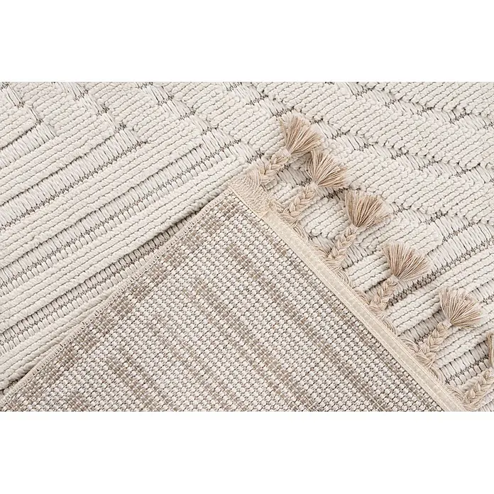 Kayoom Fransenteppich Reef 225 - Elfenbein, 150 x 80 cm, 100 % Polypropylen - Hellfarbener strukturierter Teppich mit erhabenem Muster, geflochtenen Quasten und sichtbarer gewebter Unterseite.