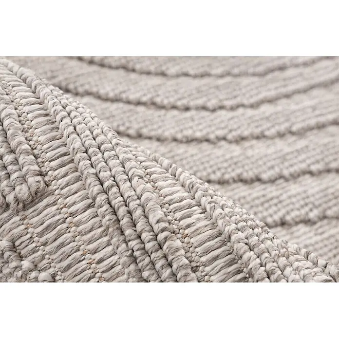 Kayoom Fransenteppich Reef 225 - Silber, 150 x 80 cm, 100 % Polypropylen - Nahaufnahme eines hellbeigen strukturierten Teppichs mit dickem, geripptem, gewebtem Muster.