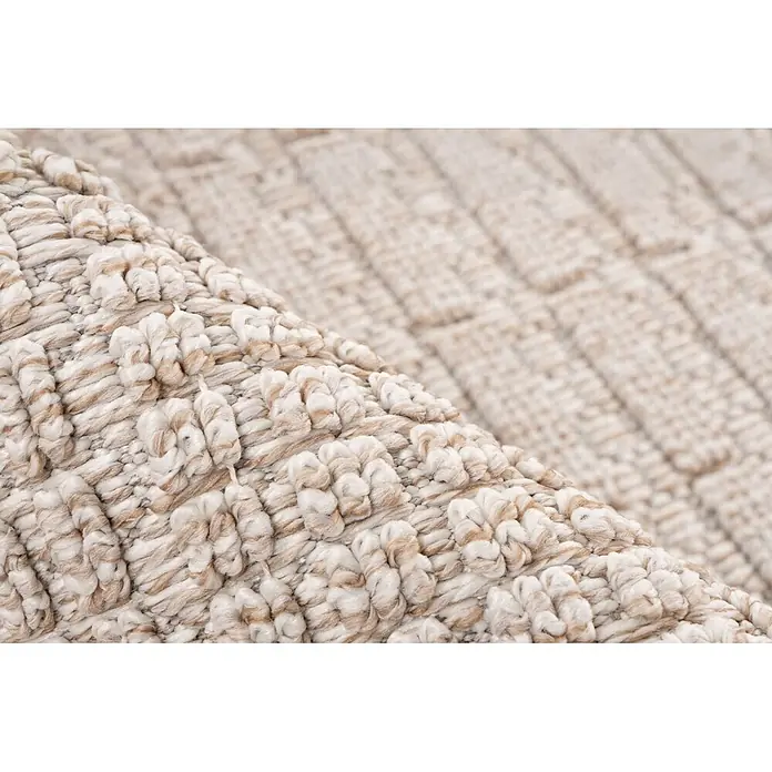 Kayoom Fransenteppich Reef 125 - Beige, 170 x 120 cm, 100 % Polypropylen - Detailansicht eines gewebten Teppichs mit beigen und cremefarbenen strukturierten Schlaufen.