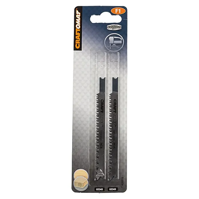 Craftomat Hoja de sierra de calar U 234 X - Madera blanda / tablero de fibra, 2 pzs., Vástago en U - Primer plano de las hojas de sierra de calar CRAFTOMAT F1 U234X en blíster, ideal para serrar madera. Accesorio práctico para profesionales y aficionados al bricolaje.
