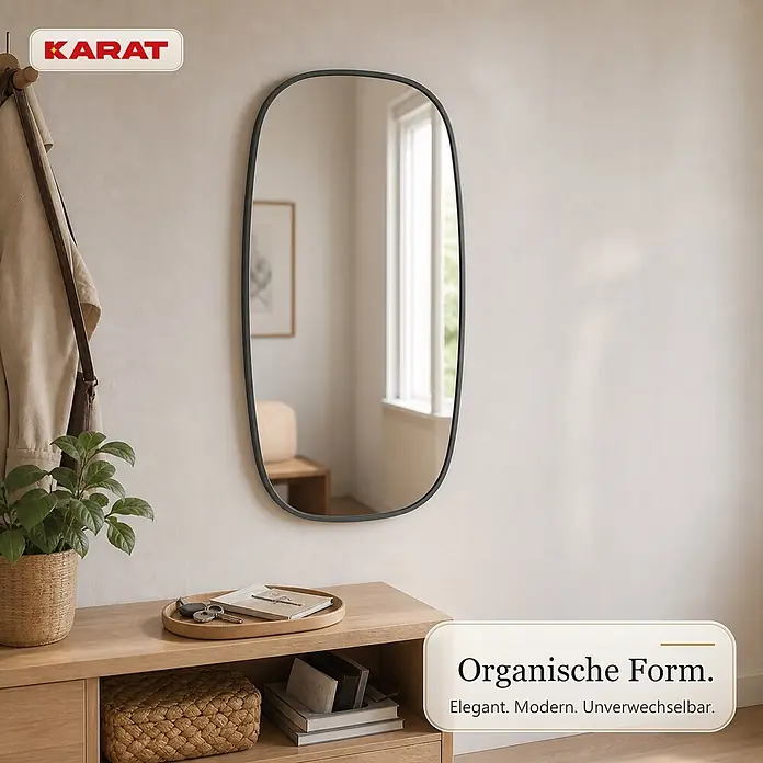 Floordirekt Wandspiegel Alina - 55,1 x 90,1 cm - KARAT Spiegel in organischer Form mit dunklem Rahmen, über einer Holzkonsole im Eingangsbereich montiert.