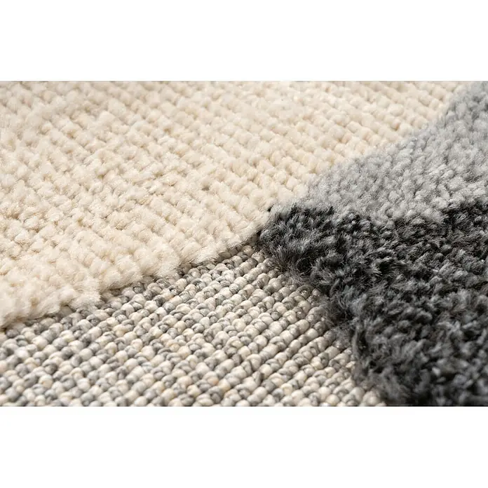 Kayoom Kinderteppich Modena 420 - Grau, Durchmesser: 133 cm, 100 % Polypropylen - Mehrtexturierter Teppich mit cremefarbenen, hellgrauen und dunkelgrauen geometrischen Abschnitten.