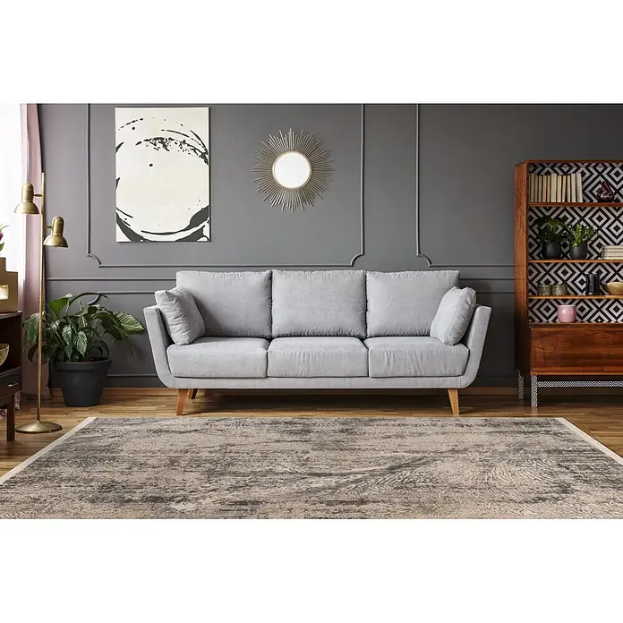 Kayoom Kurzflorteppich Adela 525 - Grau, 170 x 120 cm, 100 % Polypropylen - Abstrakt gemusterter Teppich in hell- und dunkelgrauen Tönen auf Holzboden im Wohnzimmer.