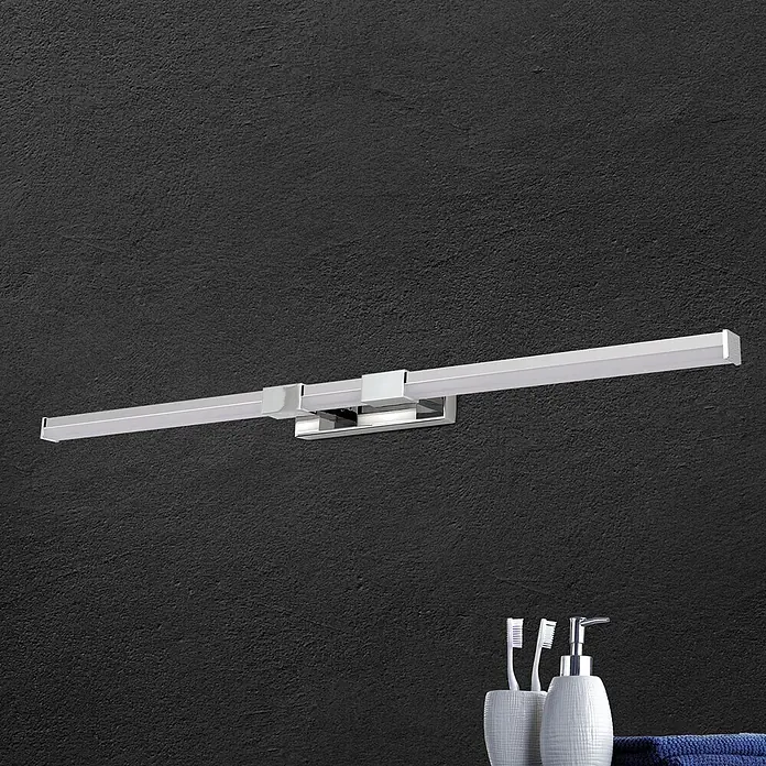 Orion Leuchten Wandleuchte - 17 W, L x B x H: 8 x 75 x 5 cm - Moderne, verchromte LED-Spiegelleuchte an dunkler Wand, mit Badaccessoires darunter.