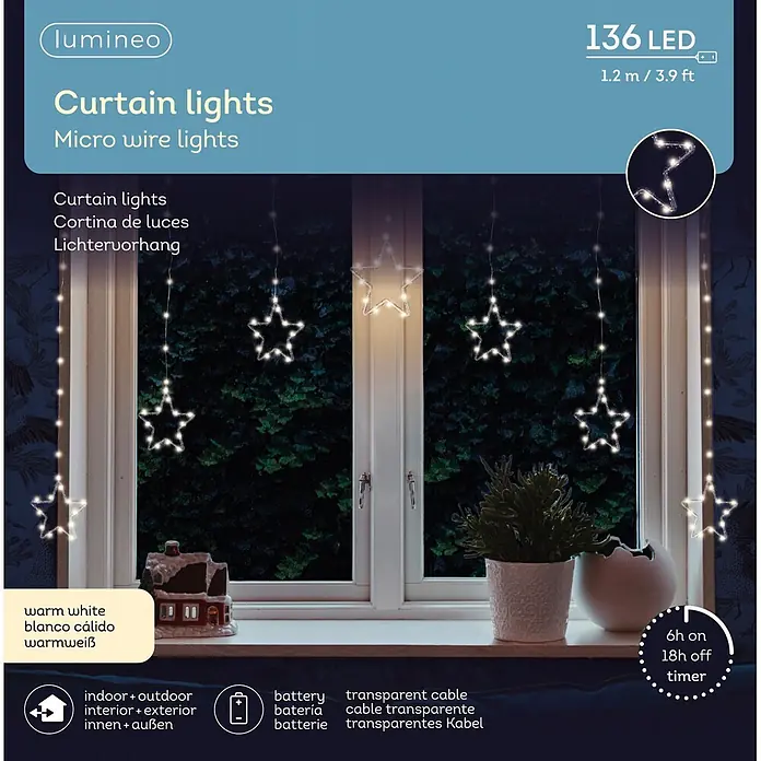 Lumineo Cascada de luces LED Estrellas - Para exterior, Largo: 120 cm - Cortina de luces LED Lumineo con forma de estrella en blanco cálido, 136 LED, 1,2m, a pilas, mostrada en una ventana.