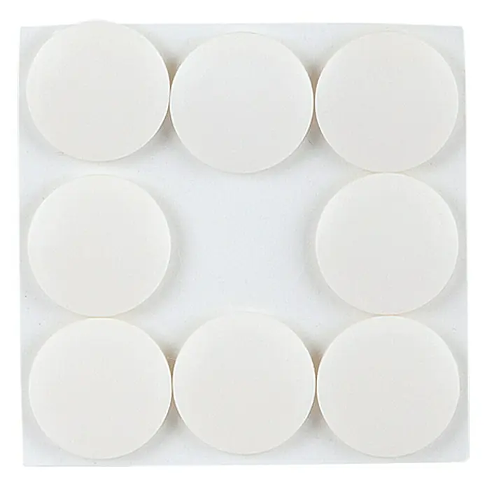 Stabilit Patín antideslizante para alfombras - 30 mm, Gris claro, 8 ud., Pegado - Primer plano de deslizadores de muebles redondos blancos dispuestos en una lámina de soporte cuadrada en una cuadrícula de 3x3.