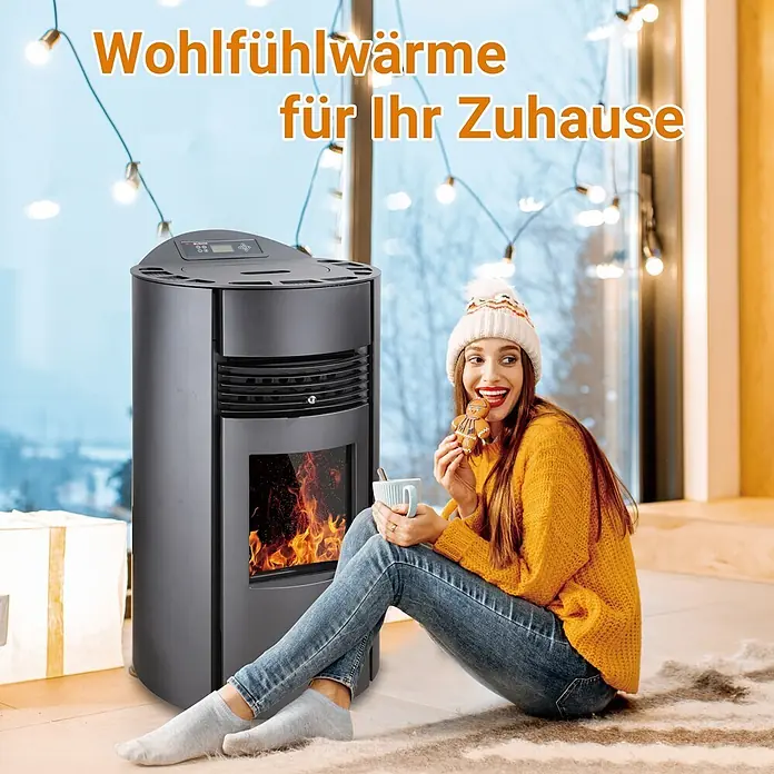 SCHENGER Pelletofen HP51-R - 8,8 kW, Raumheizvermögen: 160 m³, 0,9 kg/h, Farbe Verkleidung: Schwarz - Dunkelgrauer zylindrischer Pelletofen mit warmer Flamme, der eine gemütliche Atmosphäre in einem Zuhause schafft, wo eine Person entspannt.