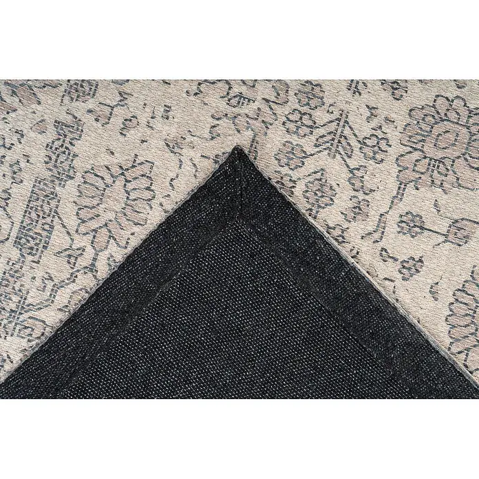 Kayoom Flachgewebeteppich Perry 125 - Creme, 170 x 120 cm, 75 % Baumwolle, 25 % Polyester - Ein heller, gemusterter Teppich mit dunkler, gewebter Rückseite, die durch eine umgeklappte Ecke sichtbar wird.