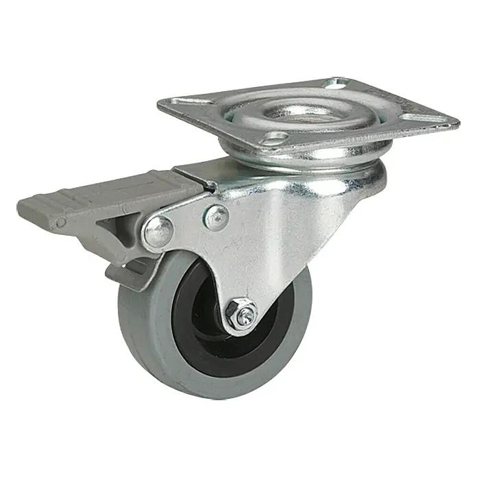 Stabilit Rueda giratoria para equipos - Diámetro ruedas: 50 mm, Capacidad de carga: 45 kg, Material rueda: Goma, Con placa y freno, Casquillo liso - Una rueda para muebles con freno, perfecta para un movimiento seguro y flexible de los muebles. La rueda es gris y tiene un diseño robusto.