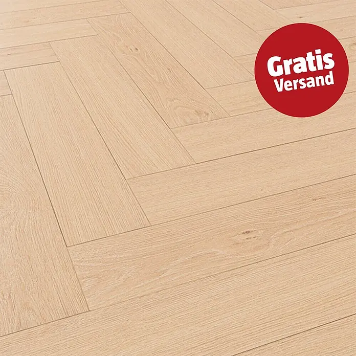 Krono Original Laminat Herringbone - Blonde Montanara Oak, Fischgrät, 630 x 126 x 8 mm - Heller beigefarbener Holzboden im Fischgrätmuster.