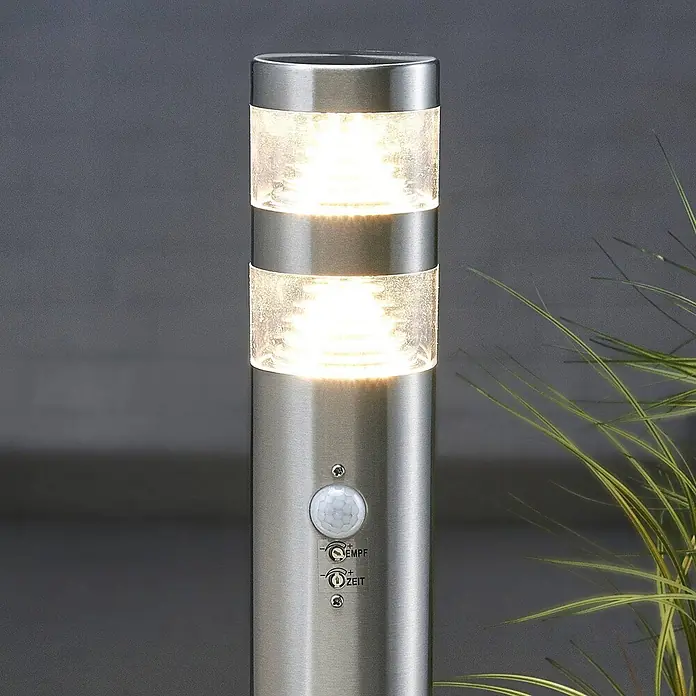 Lindby Edelstahl LED Wegeleuchte / Pollerleuchte 60 cm mit Bewegungsmelder -  - Edelstahl-Außenleuchte mit zwei beleuchteten Glasabschnitten und einstellbarem Bewegungsmelder für Empfindlichkeit und Zeit.