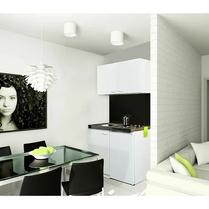 Respekta Minicocina Levin - Ancho: 100 cm, Blanco, Con placa de cocina Duo - Vista de una cocina americana minimalista con armarios blancos y electrodomésticos modernos, que combina funcionalidad y estilo en un espacio compacto.