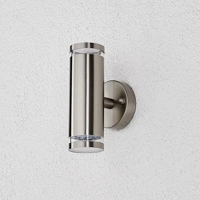 Lindby LED Wandleuchte aussen in edelstahl, transparent, Aussenlampe Wand -  - Zylindrische Edelstahl-Außenwandleuchte mit gebürsteter Oberfläche und transparenten Enden für Auf- und Abbeleuchtung.