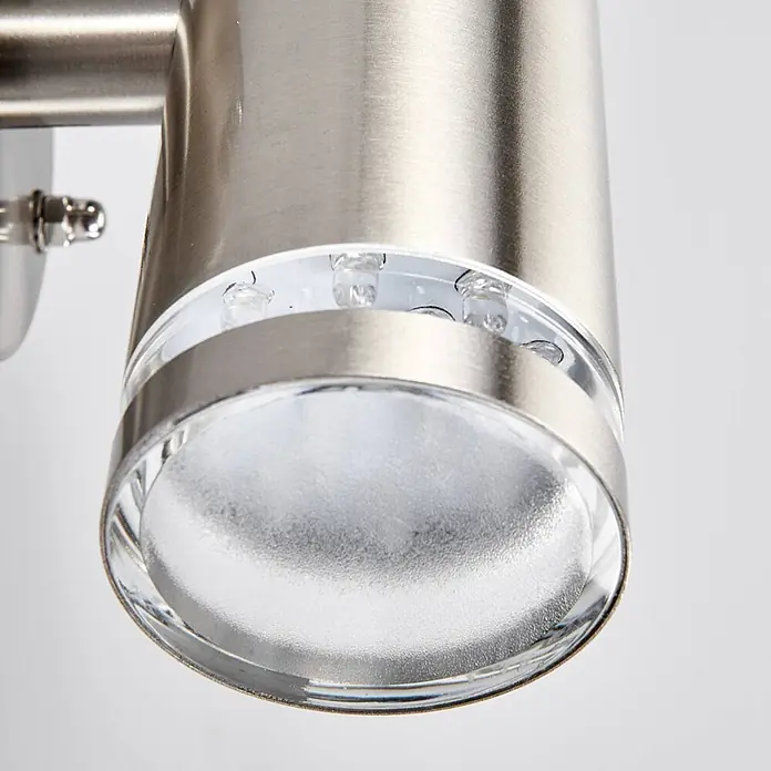 Lindby LED Wandleuchte aussen in edelstahl, transparent, Aussenlampe Wand -  - Zylindrische Außenleuchte aus gebürstetem Edelstahl mit klarer und mattierter Glaslinse, LED-Leuchten sichtbar.
