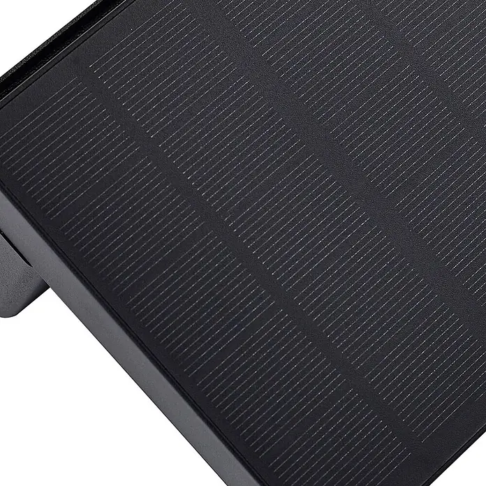 Lindby LED Solar Wandleuchte aussen in schwarz, weiß, mit Bewegungsmelder, -  - Nahaufnahme eines schwarzen Solarpanels mit sichtbaren Photovoltaikzellen und dunklem Rahmen, zur effizienten Solarenergieumwandlung.