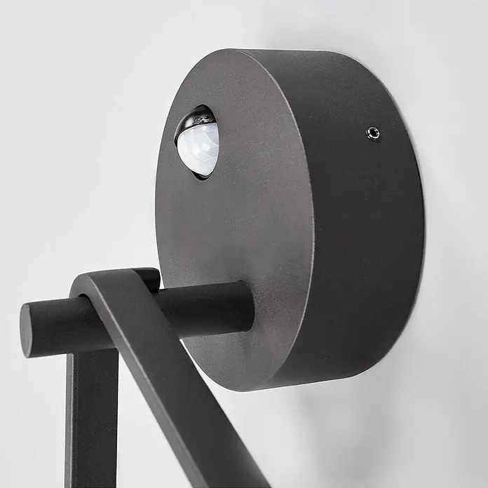 Lucande LED Wandleuchte aussen in graphit, weiß, mit Bewegungsmelder, -  - Dunkelgraue zylindrische Außenwandleuchte mit mattem Finish und integriertem Bewegungssensor.