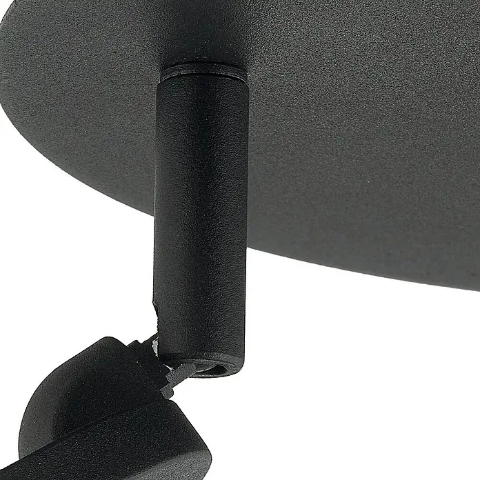 Lindby Deckenleuchte Manel - schwarz, schwarz - Nahaufnahme einer texturierten schwarzen Metall-Deckenhalterung und eines Gelenkarms für eine Leuchte.