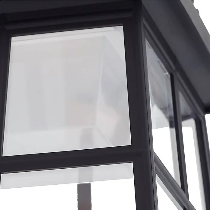 Lindby LED Solar Wandleuchte aussen in schwarz, mit Bewegungsmelder, -  - Schwarze Metalllaterne mit klaren Acrylplatten, die ihre geschlossene Struktur betont.