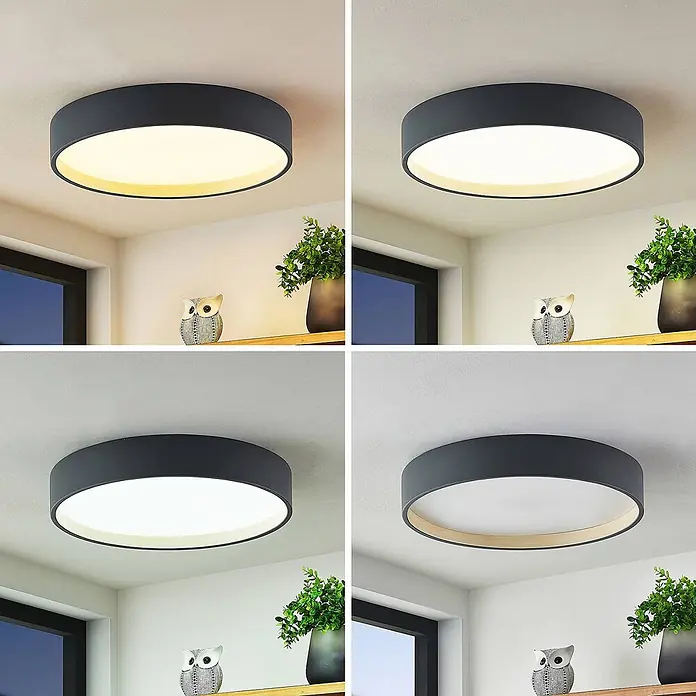 Lindby LED Deckenlampe in anthrazit, Deckenleuchte rund -  - Eine runde Deckenleuchte mit dunkelgrauem Stoffschirm und naturholzfarbenem Innenring, die verschiedene Lichtfarben zeigt.