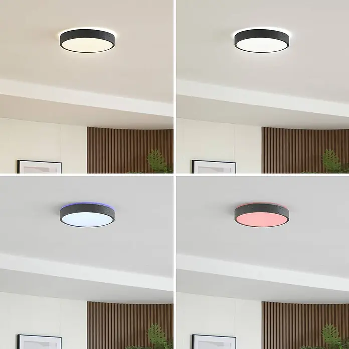 Lindby Deckenleuchte Manala - alu / grau / zink - Runde schwarze LED-Deckenleuchte mit dunkelgrauem Gehäuse, die warmweißes, kaltweißes, blaues und rotes Licht im Innenraum zeigt.