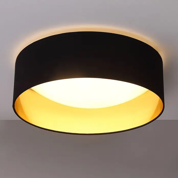 Lindby LED Deckenlampe in schwarz, gold, Deckenleuchte rund -  - Schwarze zylindrische Deckenleuchte mit goldenem Inneren, die warmes Licht an die Decke wirft.