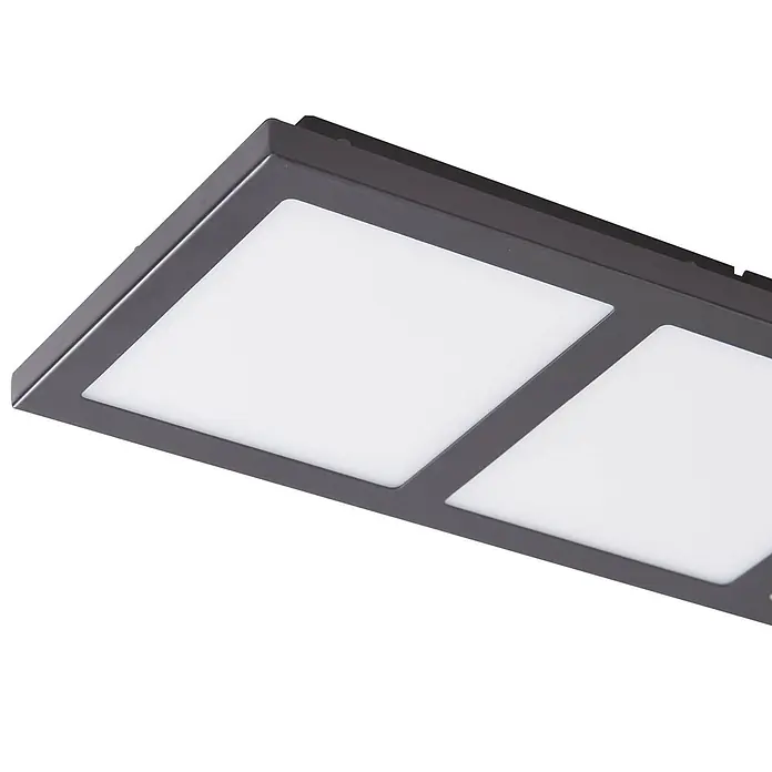 Lindby Deckenleuchte Raymie - schwarz - Nahaufnahme einer dunkelgrauen rechteckigen LED-Leuchte mit mehreren quadratischen, beleuchteten Paneelen.
