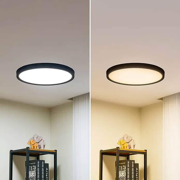 Lindby LED Deckenlampe in schwarz matt, weiß, Deckenleuchte rund -  - Runde schwarze Deckenleuchte zeigt kaltweißes und warmweißes Licht im Raum.