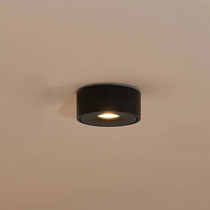 Arcchio LED Deckenlampe in schwarz, Deckenleuchte rund -  - Schwarze zylindrische Deckenaufbauleuchte strahlt warmweißes Licht aus.