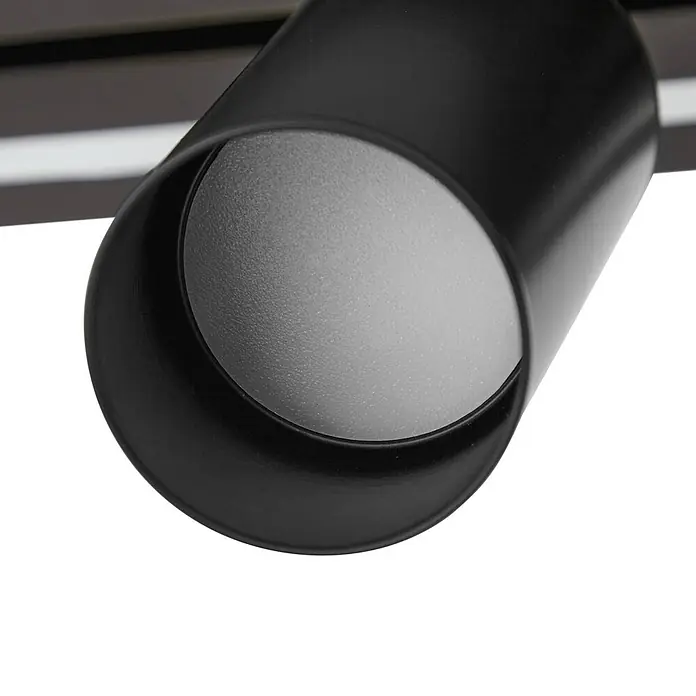 Lucande LED Deckenlampe in holz, schwarz, dimmbar Deckenstrahler -  - Schwarzer zylindrischer Strahlerkopf mit texturierter hellgrauer Innenseite, Teil eines Schienensystems.