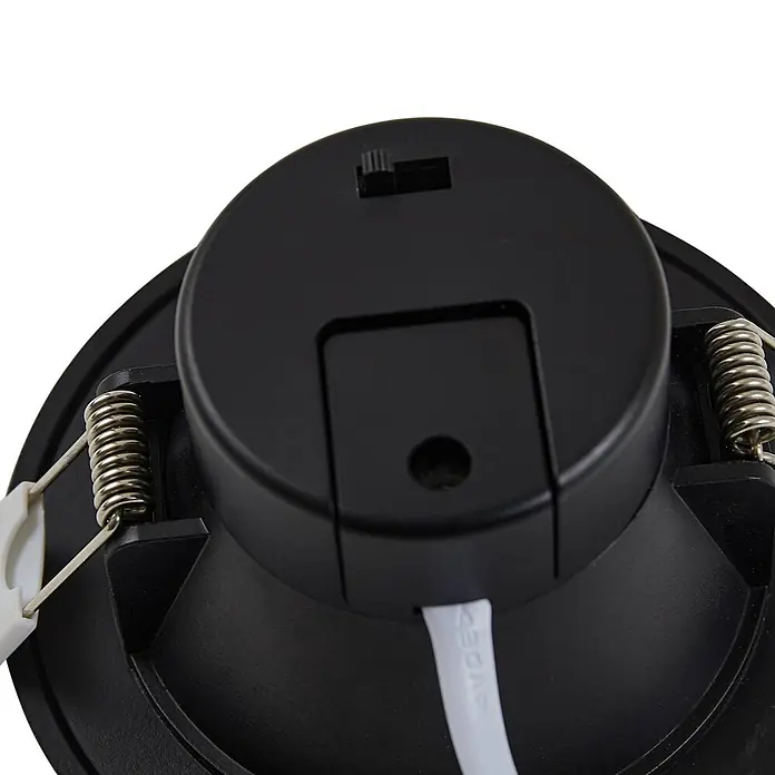PRIOS LED Einbauleuchte Decke in schwarz, Einbaustrahler -  - Rückseite einer schwarzen LED-Einbauleuchte mit silbernen Montagefedern und einem kleinen Schiebeschalter.