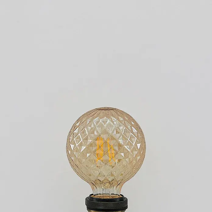 Lucande Leuchtmittel in amber, -  - Amberfarbene, strukturierte Glasglühbirne mit leuchtenden Filamenten und schwarzem Sockel.