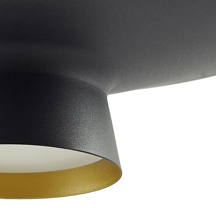 Lindby Pendelleuchte Norvind - schwarz, sandSchwarz, gold - Nahaufnahme einer mattschwarzen Leuchte mit texturierter Oberfläche und goldener Innenseite.