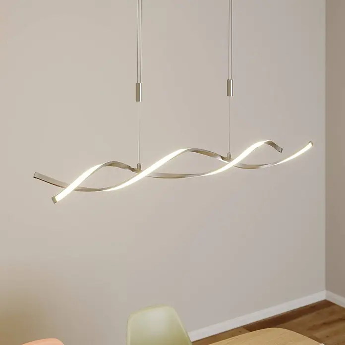 Lindby LED Pendelleuchte in nickel satiniert, weiß, Hängelampe -  - Beleuchtete moderne silberne Wellen-LED-Pendelleuchte, über einem Essbereich hängend.