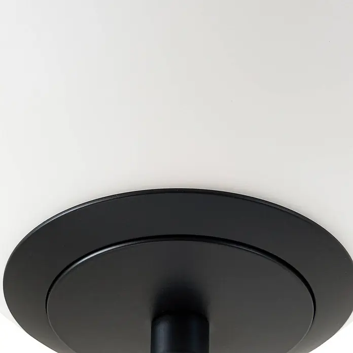 Lucande LED Stehlampe Wohnzimmer in weiß, schwarz, dimmbar Stehleuchte -  - Nahaufnahme eines schwarzen, runden, geschichteten Bauteils, wahrscheinlich ein Sockel für eine Leuchte.