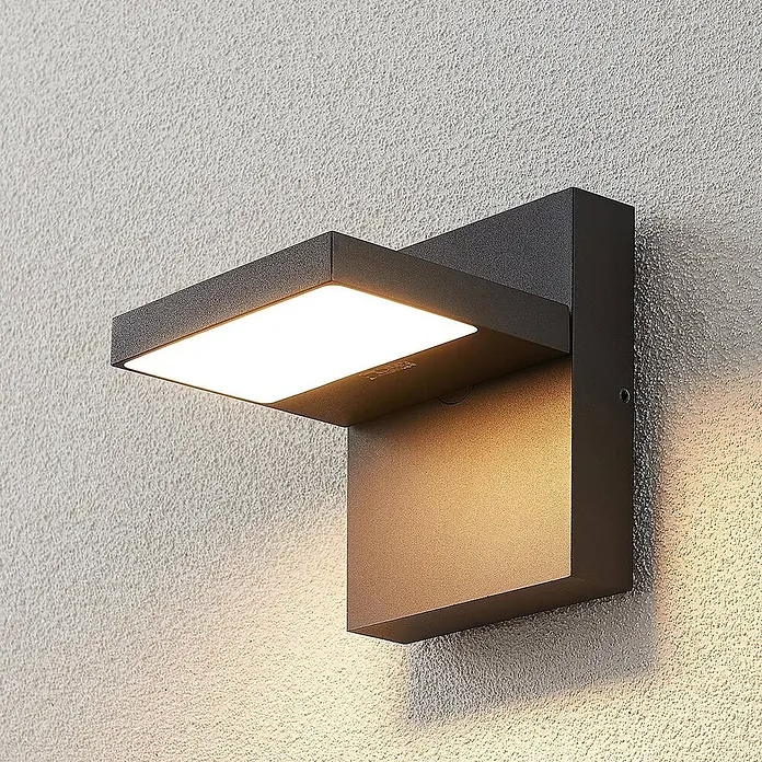 Lucande LED Wandleuchte aussen in anthrazit, Aussenlampe Wand -  - Moderne dunkelgraue Außenwandleuchte mit Ober- und Unterlicht, an einer strukturierten Wand montiert.