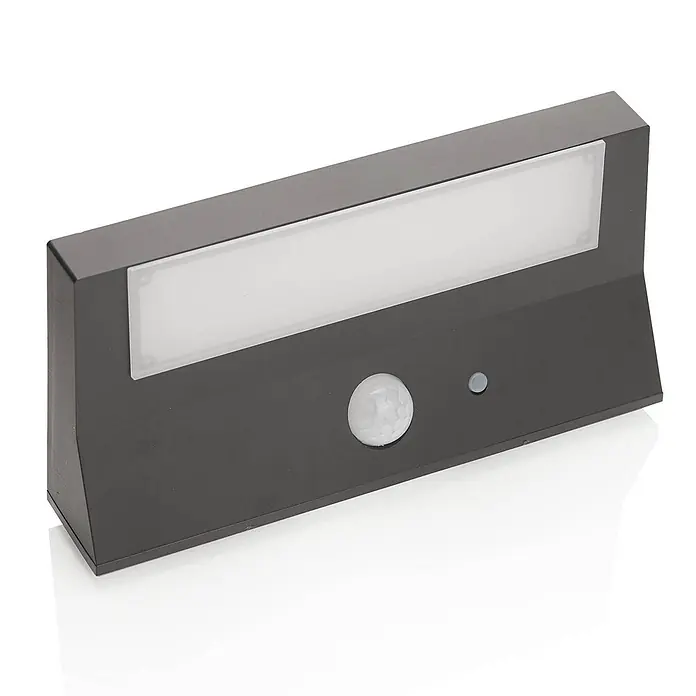 Lindby Außenwandleuchte Maresia - alu / grau / zink, IP44 - Dunkelgraue rechteckige Außenleuchte mit weißem Lichtpanel, Bewegungssensor und kleinem Knopf.