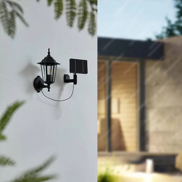 Lindby LED Solar Wandleuchte aussen in schwarz, Aussenlampe Wand -  - Schwarze solarbetriebene Wandlaterne im klassischen Design mit sichtbarer Glühbirne, außen mit Solarpanel montiert.