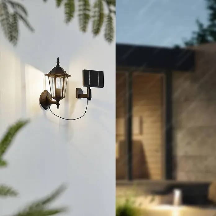 Lindby LED Solar Wandleuchte aussen in schwarz, Aussenlampe Wand -  - Dunkle Außenwandleuchte mit Solarpanel, beleuchtet eine Wand im Außenbereich.