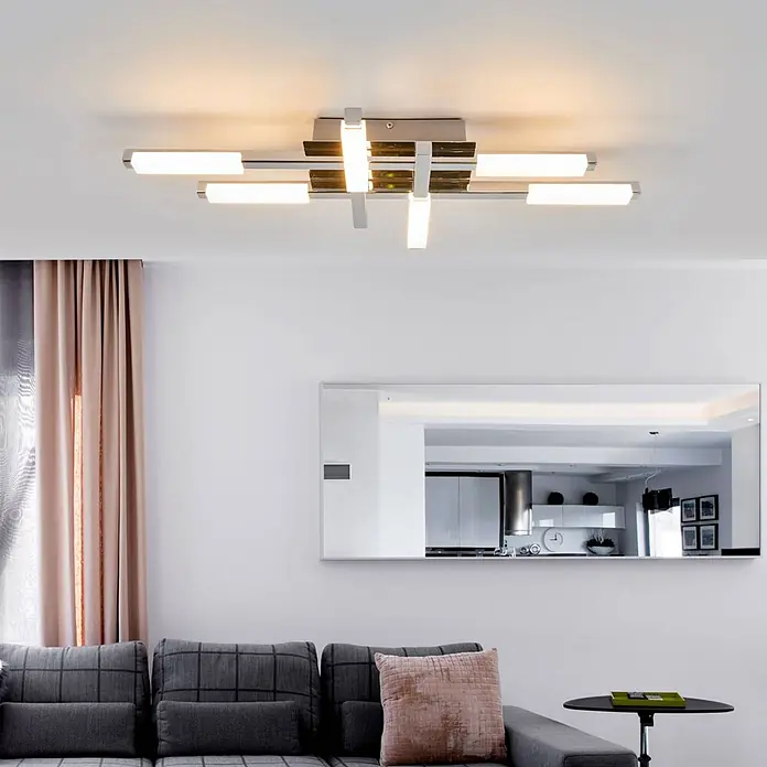 Lindby LED Deckenlampe in weiß, chrom, Deckenleuchte -  - Moderne lineare Deckenleuchte aus Chrom mit mehreren beleuchteten Stäben an einer weißen Decke im Wohnzimmer.