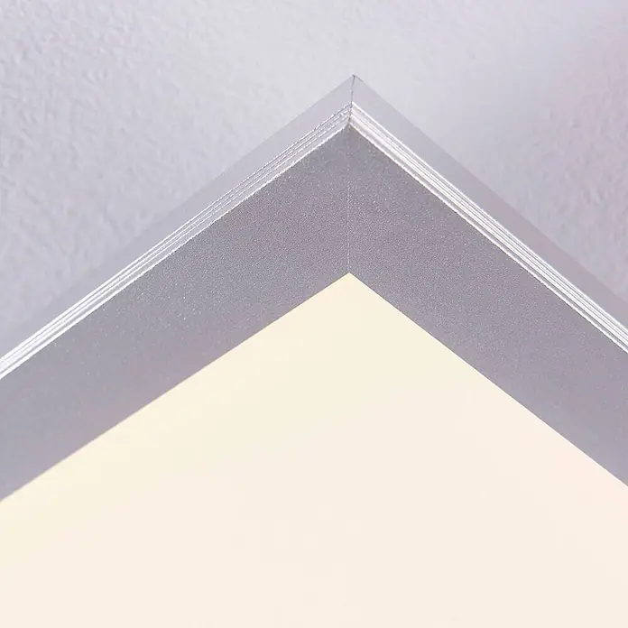 Lindby LED-Panel Livel - alu / grau / zink - Silberner Metalleckrahmen mit feinen Rillen, Teil einer Leuchtplatte.